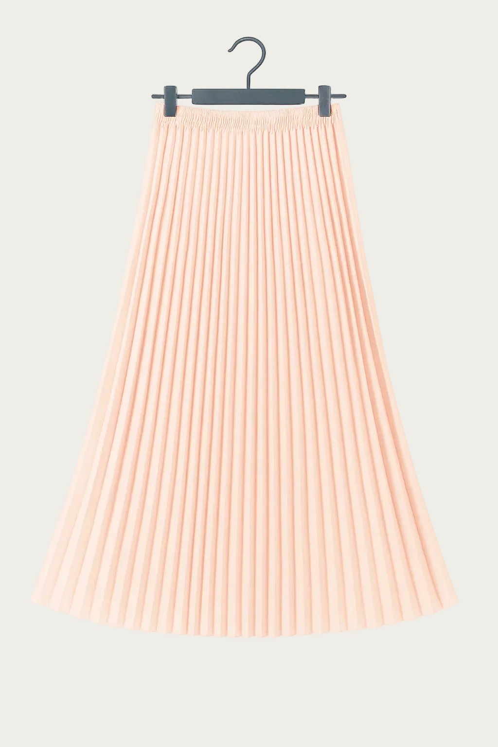 Jupe longue plissée rose pâle suspendue sur cintre, tenue fluide et élégante idéale pour un look EVJF.