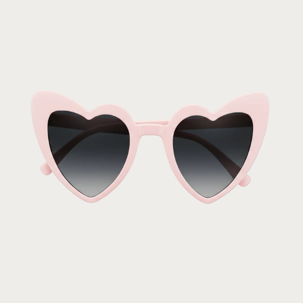 Lunettes de soleil EVJF roses en forme de cœur avec verres foncés, posées sur fond clair.